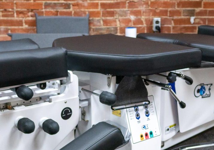 Photo of a Cox Technic Flexion/Distraction Table used for chiropractic adjustments at Frenchtown Chiropractic in St Louis, MO